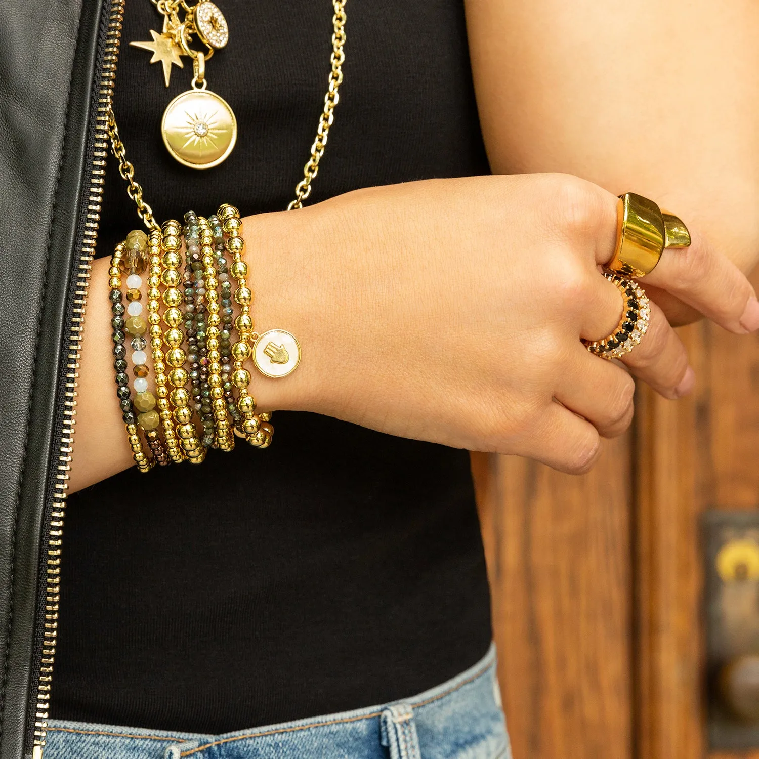 stretch ball bracelet with enamel hamsa disc charm